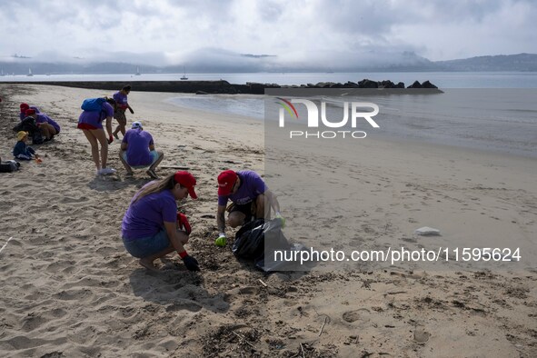 Several volunteers collect waste and garbage during a beach cleanup day in the municipality of Alges in Lisbon, Portugal, on September 21, 2...