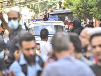 Rescuers sift through the rubble at the scene of an Israeli strike that targets Beirut's southern suburbs, as search and rescue operations c...