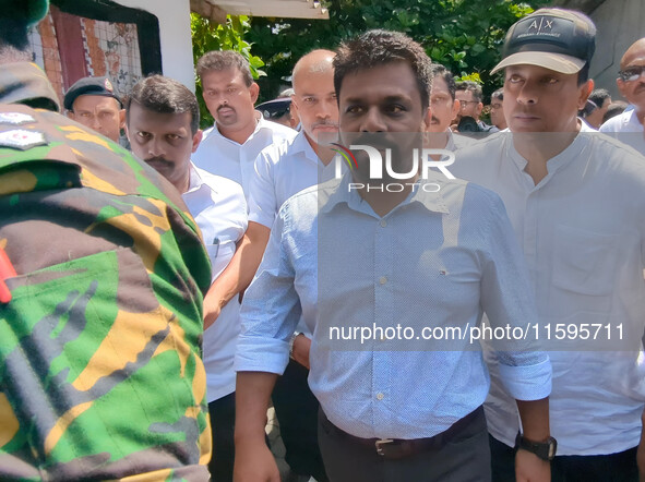 Sri Lanka's presidential candidate of National People's Power (NPP), Anura Kumara Dissanayake, leaves after casting his vote at a polling ce...