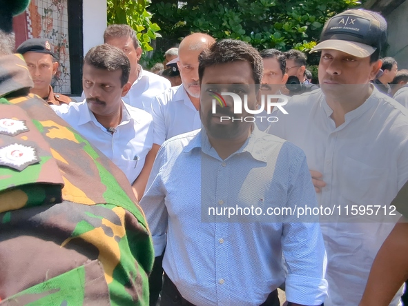 Sri Lanka's presidential candidate of National People's Power (NPP), Anura Kumara Dissanayake, leaves after casting his vote at a polling ce...