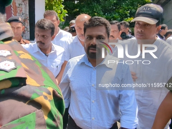 Sri Lanka's presidential candidate of National People's Power (NPP), Anura Kumara Dissanayake, leaves after casting his vote at a polling ce...