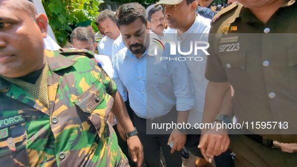 Sri Lanka's presidential candidate of National People's Power (NPP), Anura Kumara Dissanayake, leaves after casting his vote at a polling ce...