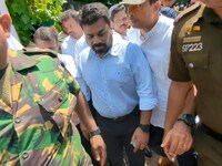 Sri Lanka's presidential candidate of National People's Power (NPP), Anura Kumara Dissanayake, leaves after casting his vote at a polling ce...