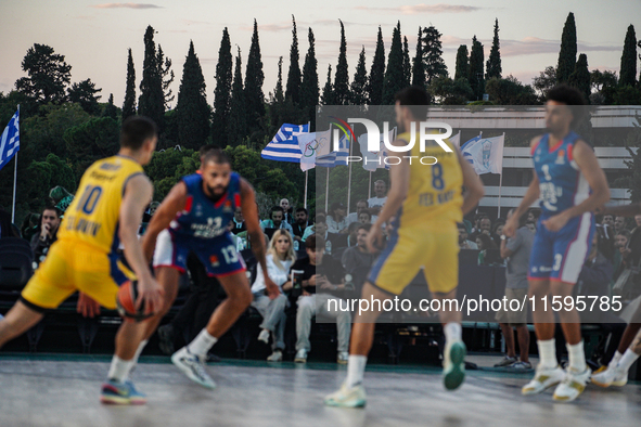 The flags of Greece and the Olympic Games are displayed during the match between Maccabi Playtika Tel Aviv and Anadolu Efes for the Pavlos G...