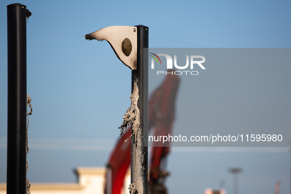 The remnants of a melted rock climbing wall in a playground are visible following a liquefied gas pipeline explosion in a residential area o...