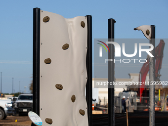 A rock climbing wall in a playground warps from the intense heat of a liquefied gas pipeline explosion in a residential area of La Porte nea...