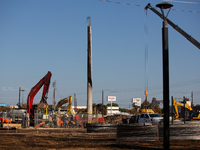 Workers repair a damaged liquefied gas pipeline following an explosion earlier in the week in La Porte, near Houston, Texas, on September 21...