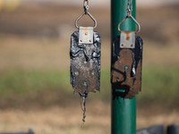 A playground swing melts from the intense heat of a liquefied gas pipeline explosion in a residential area of La Porte near Houston, Texas,...