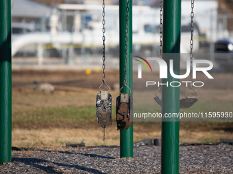 A playground swing melts from the intense heat of a liquefied gas pipeline explosion in a residential area of La Porte near Houston, Texas,...