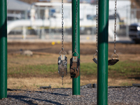 A playground swing melts from the intense heat of a liquefied gas pipeline explosion in a residential area of La Porte near Houston, Texas,...