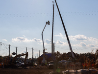 Workers repair a damaged liquefied gas pipeline following an explosion earlier in the week in La Porte, near Houston, Texas, on September 21...