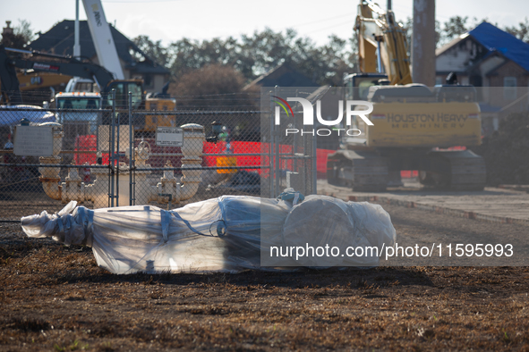 A new pipeline component is wrapped in plastic, ready for installation following a liquefied gas pipeline explosion in a residential area of...