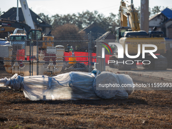 A new pipeline component is wrapped in plastic, ready for installation following a liquefied gas pipeline explosion in a residential area of...