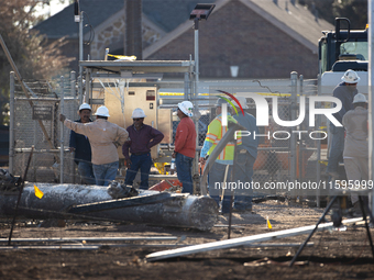 Near the site of the explosion in La Porte near Houston, Texas, on September 21, 2024, workers convene under what appears to be the melted i...