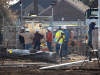 Near the site of the explosion in La Porte near Houston, Texas, on September 21, 2024, workers convene under what appears to be the melted i...