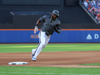 New York Mets' Starling Marte #6 scores during the seventh inning of the baseball game against the Philadelphia Phillies at Citi Field in Co...