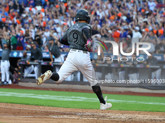 Brandon Nimmo #9 of the New York Mets scores during the seventh inning of the baseball game against the Philadelphia Phillies at Citi Field...