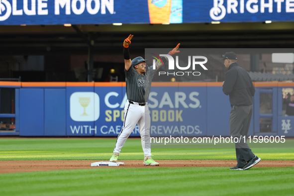 Francisco Alvarez #4 of the New York Mets celebrates after driving in two runs with a double during the seventh inning of the baseball game...