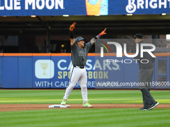 Francisco Alvarez #4 of the New York Mets celebrates after driving in two runs with a double during the seventh inning of the baseball game...