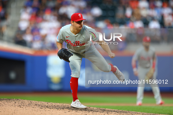 Philadelphia Phillies relief pitcher Tanner Banks #58 throws during the eighth inning of a baseball game against the New York Mets at Citi F...