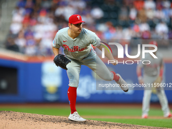 Philadelphia Phillies relief pitcher Tanner Banks #58 throws during the eighth inning of a baseball game against the New York Mets at Citi F...