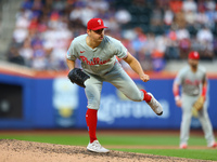 Philadelphia Phillies relief pitcher Tanner Banks #58 throws during the eighth inning of a baseball game against the New York Mets at Citi F...