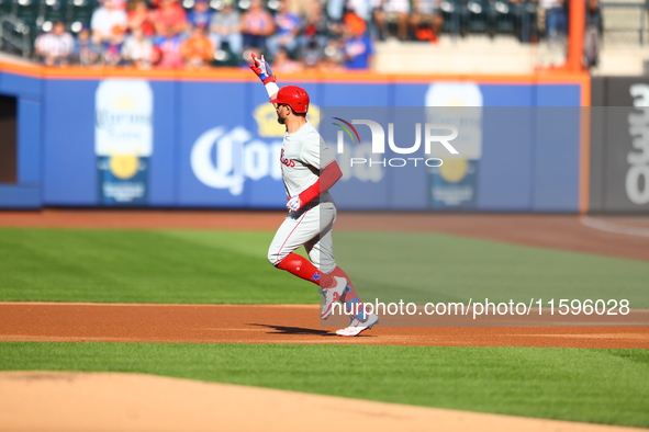 Philadelphia Phillies' Kyle Schwarber #12 rounds the bases after homering during the first inning of a baseball game against the New York Me...