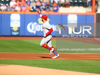 Philadelphia Phillies' Kyle Schwarber #12 rounds the bases after homering during the first inning of a baseball game against the New York Me...