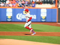 Philadelphia Phillies' Kyle Schwarber #12 rounds the bases after homering during the first inning of a baseball game against the New York Me...