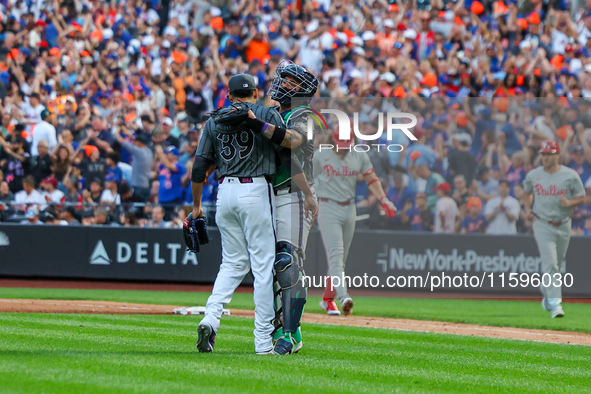 New York Mets relief pitcher Edwin Diaz #39 and catcher Francisco Alvarez #4 celebrate the Mets' 6-2 win in the baseball game against the Ph...