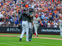 New York Mets relief pitcher Edwin Diaz #39 and catcher Francisco Alvarez #4 celebrate the Mets' 6-2 win in the baseball game against the Ph...