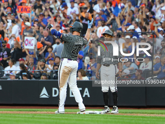 Pete Alonso #20 of the New York Mets celebrates after his RBI single during the eighth inning of the baseball game against the Philadelphia...