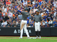 Pete Alonso #20 of the New York Mets celebrates after his RBI single during the eighth inning of the baseball game against the Philadelphia...