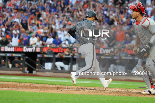 Jose Iglesias #11 of the New York Mets scores during the eighth inning of the baseball game against the Philadelphia Phillies at Citi Field...