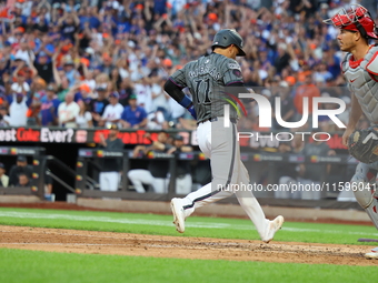 Jose Iglesias #11 of the New York Mets scores during the eighth inning of the baseball game against the Philadelphia Phillies at Citi Field...