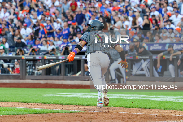 Francisco Alvarez #4 of the New York Mets doubles to drive in two runs during the seventh inning of the baseball game against the Philadelph...