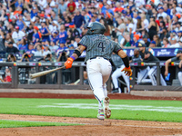 Francisco Alvarez #4 of the New York Mets doubles to drive in two runs during the seventh inning of the baseball game against the Philadelph...