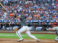 Francisco Alvarez #4 of the New York Mets doubles to drive in two runs during the seventh inning of the baseball game against the Philadelph...