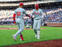 Nick Castellanos #8 of the Philadelphia Phillies is congratulated after homering during the fifth inning of a baseball game against the New...