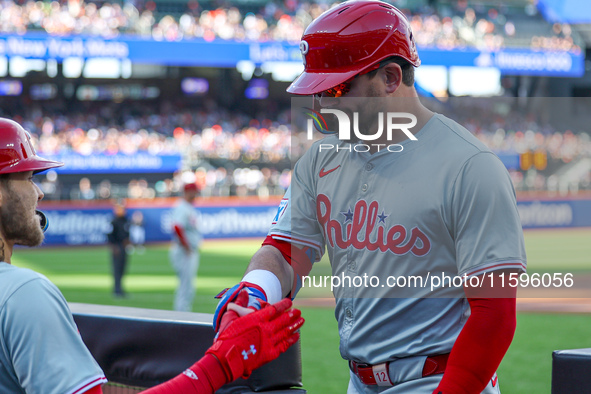 Philadelphia Phillies' Kyle Schwarber #12 is congratulated after homering during the first inning of a baseball game against the New York Me...