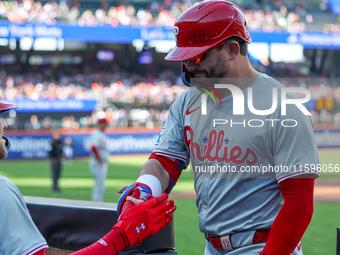 Philadelphia Phillies' Kyle Schwarber #12 is congratulated after homering during the first inning of a baseball game against the New York Me...