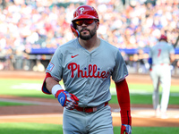 Philadelphia Phillies' Kyle Schwarber #12 is congratulated after homering during the first inning of a baseball game against the New York Me...