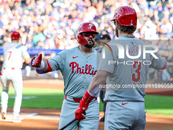 Philadelphia Phillies' Kyle Schwarber #12 is congratulated after homering during the first inning of a baseball game against the New York Me...