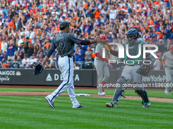 New York Mets relief pitcher Edwin Diaz #39 and catcher Francisco Alvarez #4 celebrate the Mets' 6-2 win in the baseball game against the Ph...