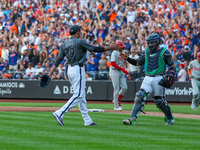 New York Mets relief pitcher Edwin Diaz #39 and catcher Francisco Alvarez #4 celebrate the Mets' 6-2 win in the baseball game against the Ph...