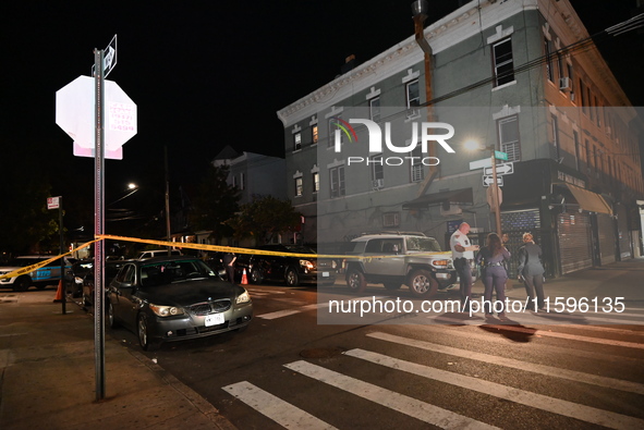 Police investigate the crime scene where a 26-year-old man is shot in the Highland Park section of Brooklyn, New York, United States, on Sep...