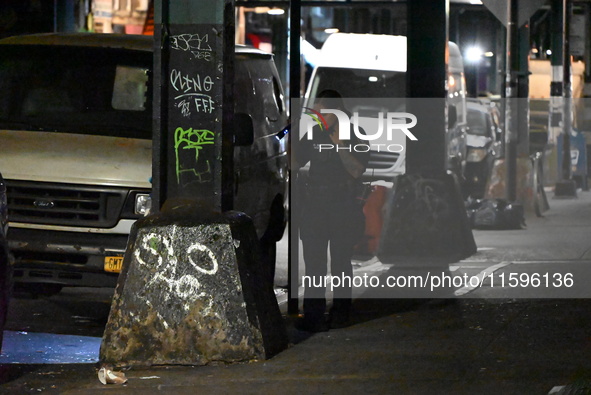 Police investigate the crime scene where a 26-year-old man is shot in the Highland Park section of Brooklyn, New York, United States, on Sep...