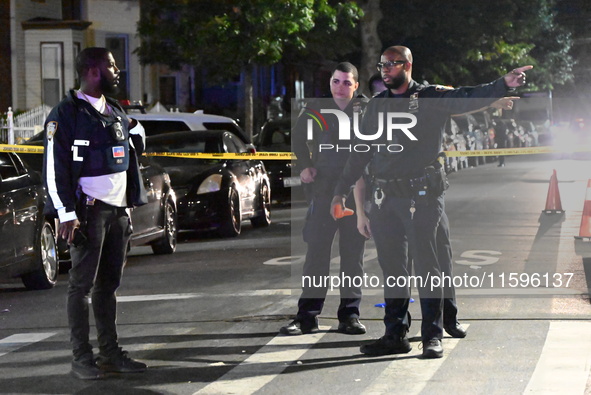 Police investigate the crime scene where a 26-year-old man is shot in the Highland Park section of Brooklyn, New York, United States, on Sep...