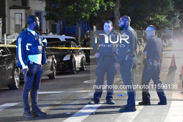 Police investigate the crime scene where a 26-year-old man is shot in the Highland Park section of Brooklyn, New York, United States, on Sep...