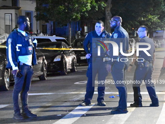 Police investigate the crime scene where a 26-year-old man is shot in the Highland Park section of Brooklyn, New York, United States, on Sep...